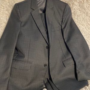 Brand new gray suit with black strips, it has pants and a vest.
